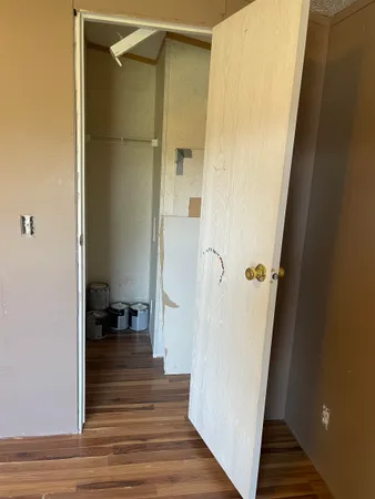 a view of a bathroom from a hallway