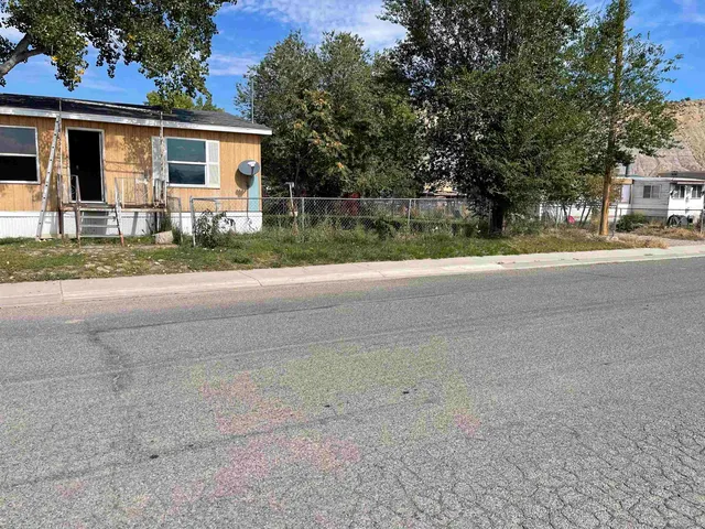 front view of a house with a street