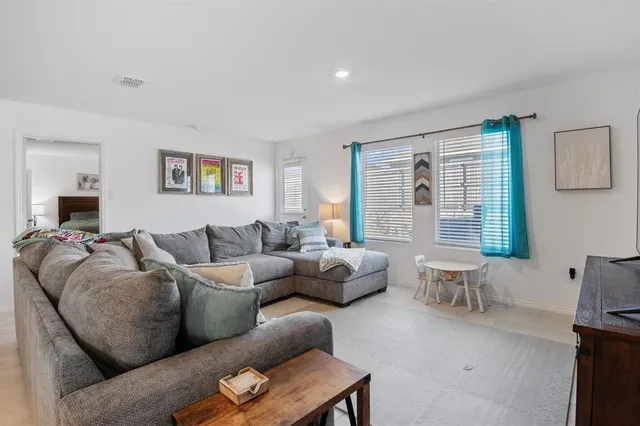 a living room with furniture and a couch