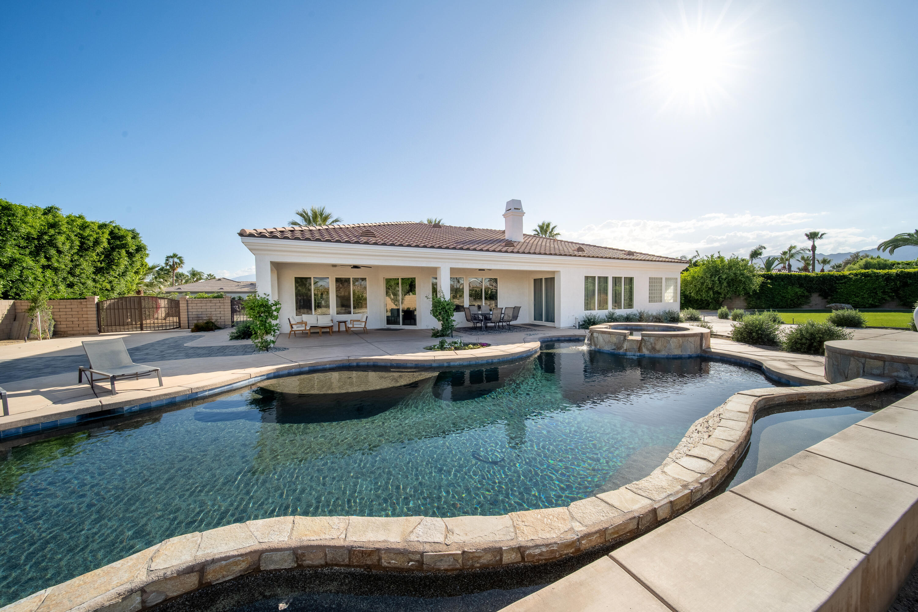 80262 Amazon Avenue Indio, CA 92201 - Photo 59 of 69 a view of a house with swimming pool and a yard