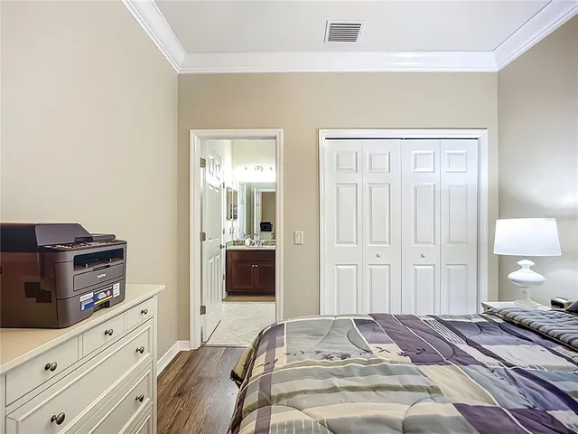 a bedroom with a bed and a dresser