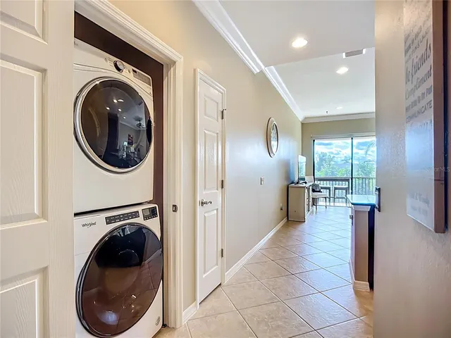 a view of a hallway with washer and dryer