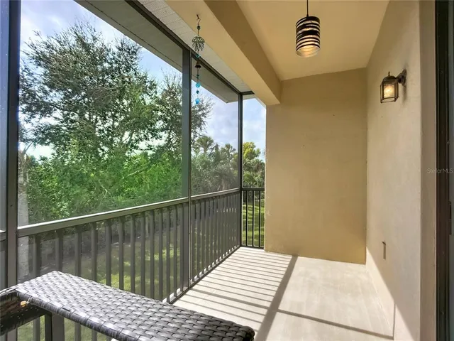 a view of balcony and wooden floor