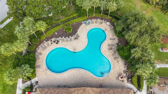 an aerial view of a swimming pool outdoor seating and entertaining space