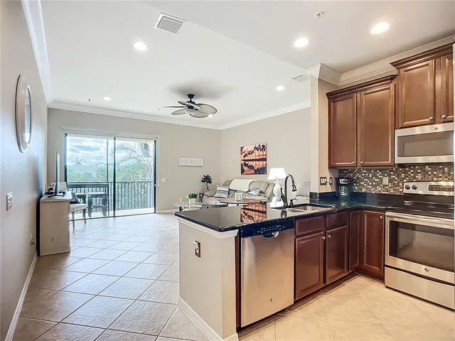 a kitchen with a sink and appliances