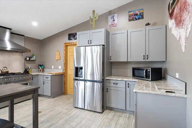 a view of a lake with a table and chairs