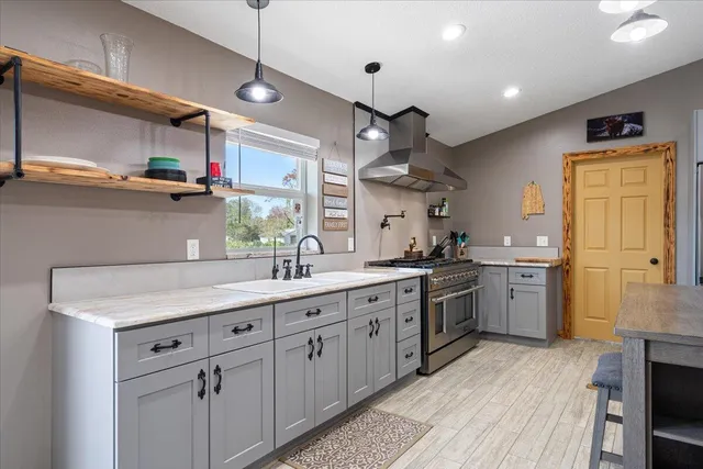 a view of a swimming pool with a table and chairs
