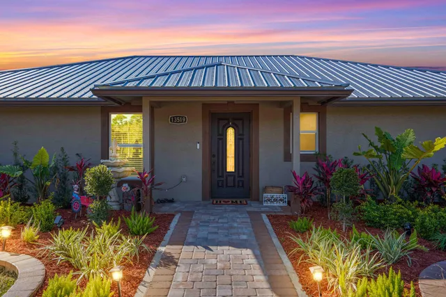 a bathroom with a sink a toilet a mirror and shower
