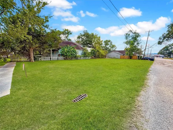 a view of field with trees in the background