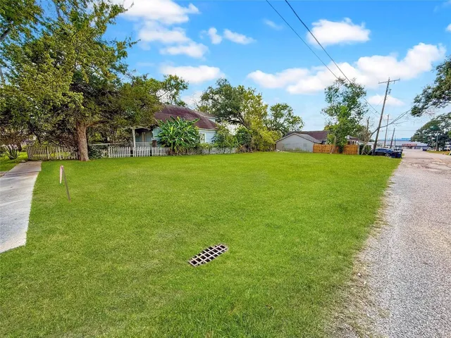 a view of field with trees in the background