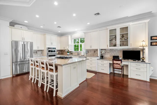 a kitchen with a sink stove and cabinets