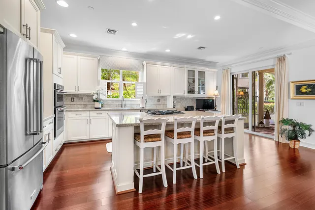 a storage room with wooden floor and cabinets