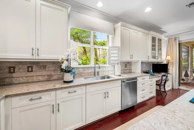 a large bathroom with a sink a large mirror and a shower