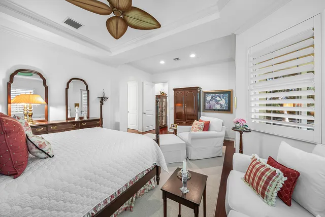 a bedroom with furniture and a window