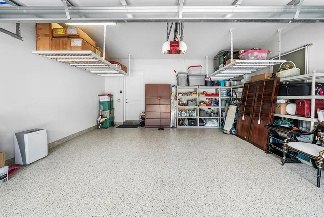 front view of a house with a yard garden and patio