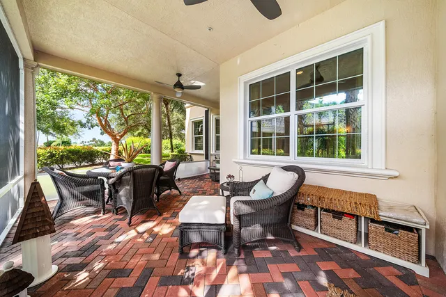 a view of a house with a yard and pathway