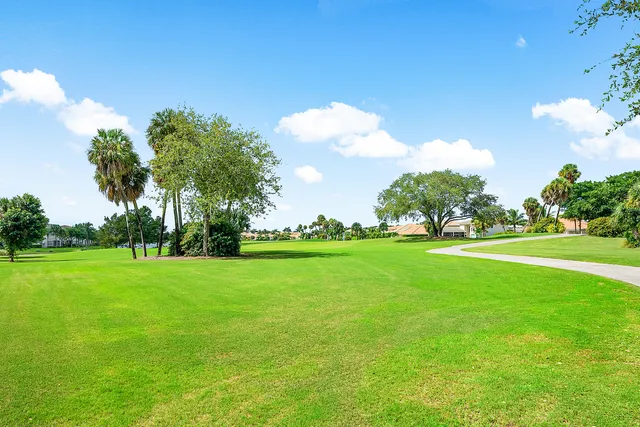 an aerial view of residential houses with outdoor space and river view
