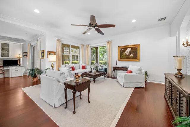 a living room with furniture and kitchen view