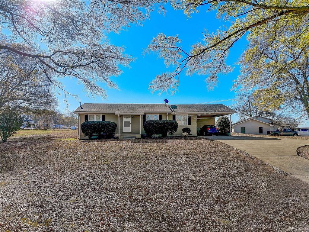 180 Bart Manous Road Canton, GA 30115 - Photo 1 of 1 a view of a house with a yard