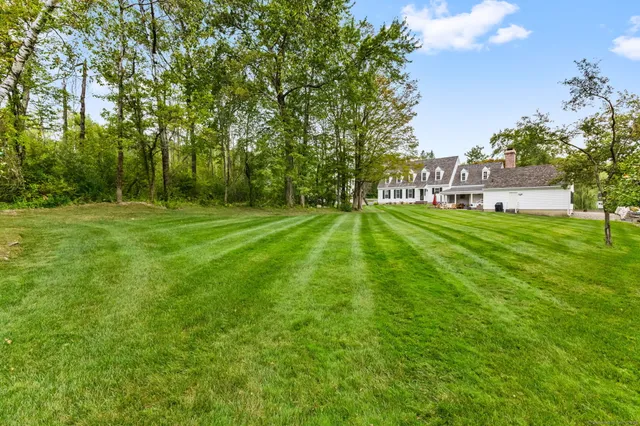 a backyard of a house with lots of green space
