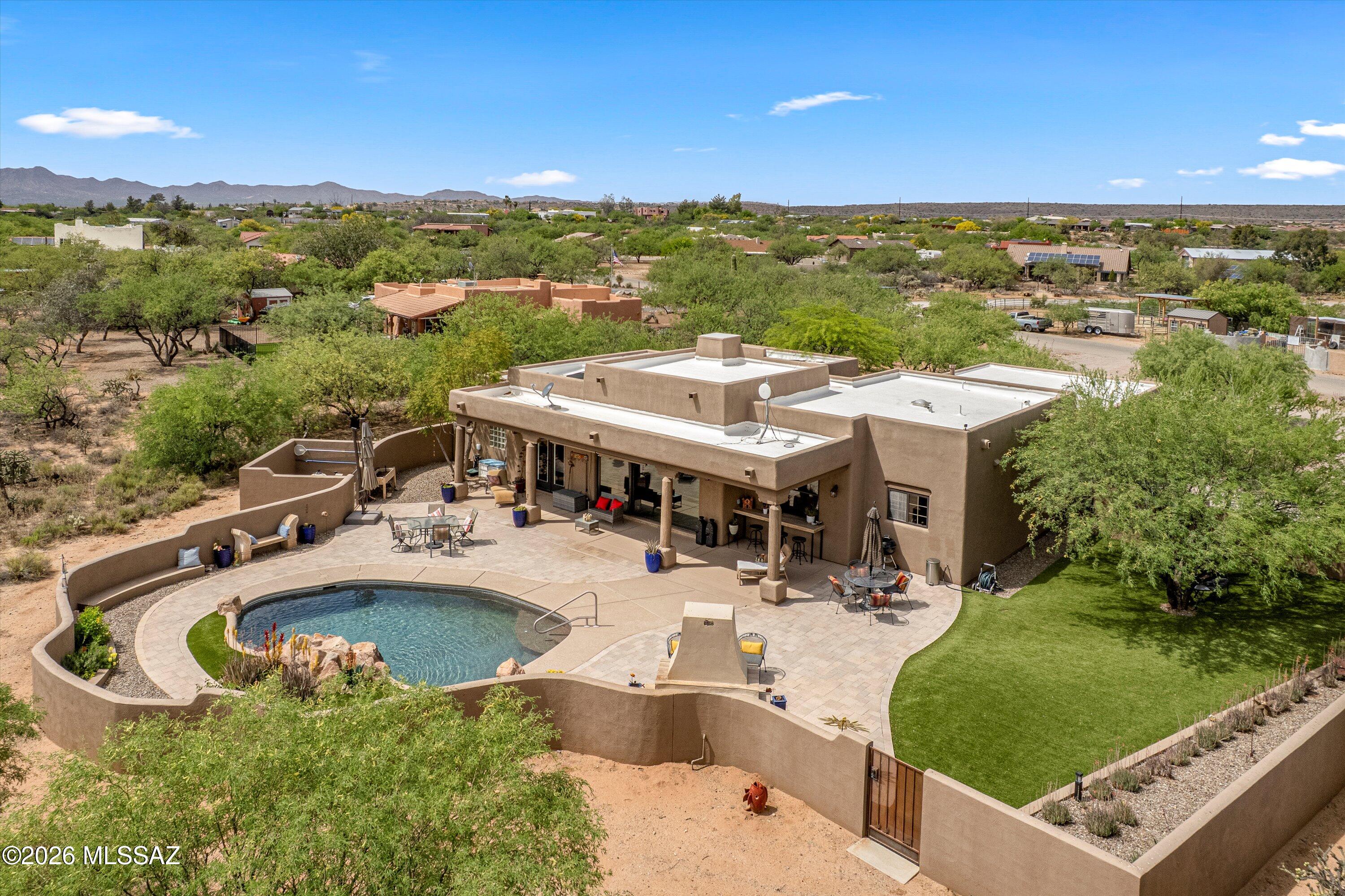 4760 East Wagon Train Road Tucson, AZ 85739 - Photo 32 of 38 a view of a swimming pool with a patio