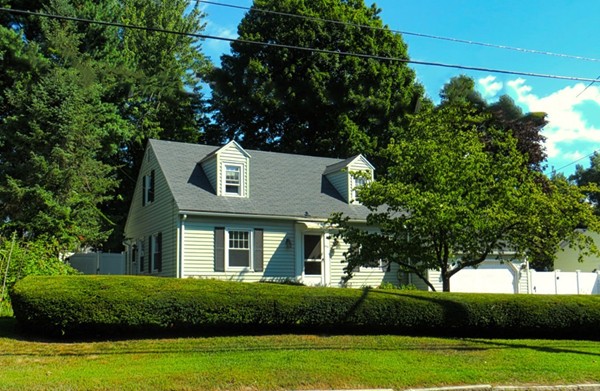 969 Allen Street Springfield, MA 01118 - Photo 1 of 21 a front view of a house with a yard