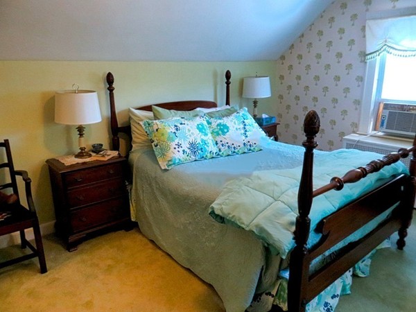 969 Allen Street Springfield, MA 01118 - Photo 12 of 21 a bed room with a bed and a lamp
