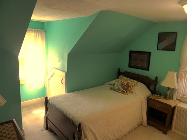 969 Allen Street Springfield, MA 01118 - Photo 15 of 21 a bedroom with a bed and a television