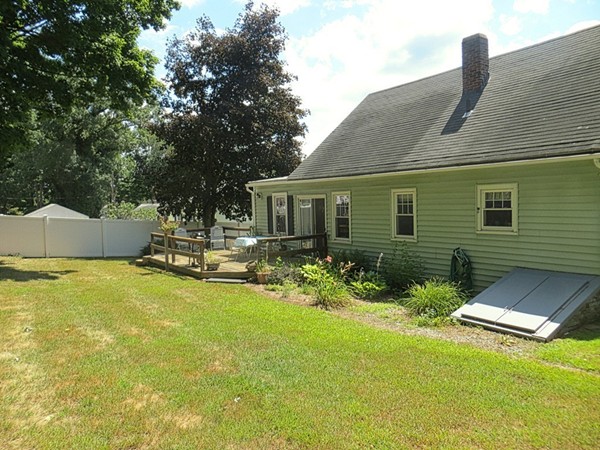 969 Allen Street Springfield, MA 01118 - Photo 18 of 21 a front view of house with yard and trees in the background