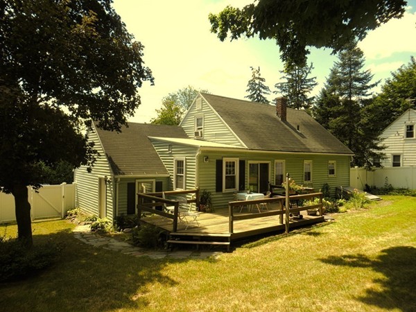 969 Allen Street Springfield, MA 01118 - Photo 19 of 21 a front view of a house with a yard patio and fire pit