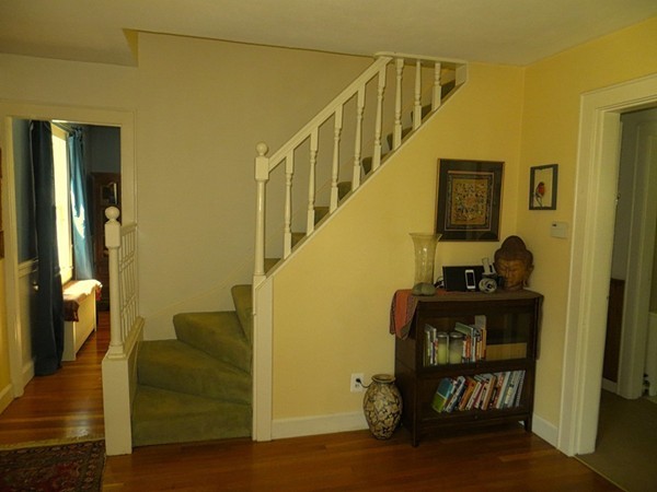 969 Allen Street Springfield, MA 01118 - Photo 5 of 21 a living room with furniture and a piano