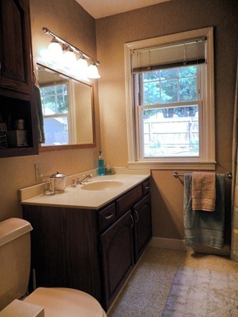 969 Allen Street Springfield, MA 01118 - Photo 6 of 21 a bathroom with a sink toilet and mirror
