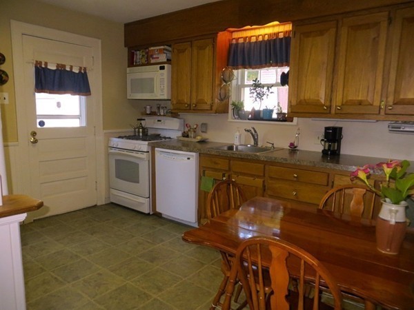 969 Allen Street Springfield, MA 01118 - Photo 7 of 21 a kitchen with a sink cabinets and window