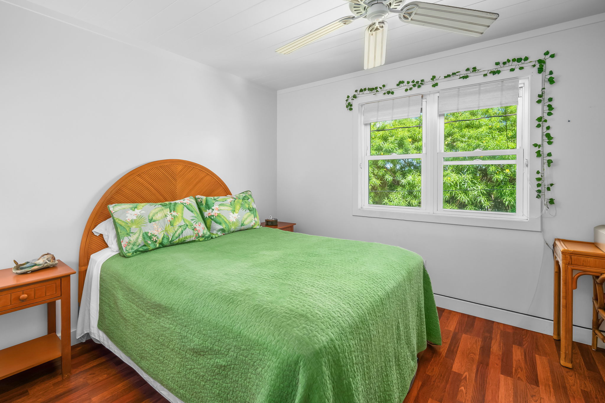 8244 A Elepaio Road Kekaha, HI 96752 - Photo 11 of 21 a bedroom with a bed and a window