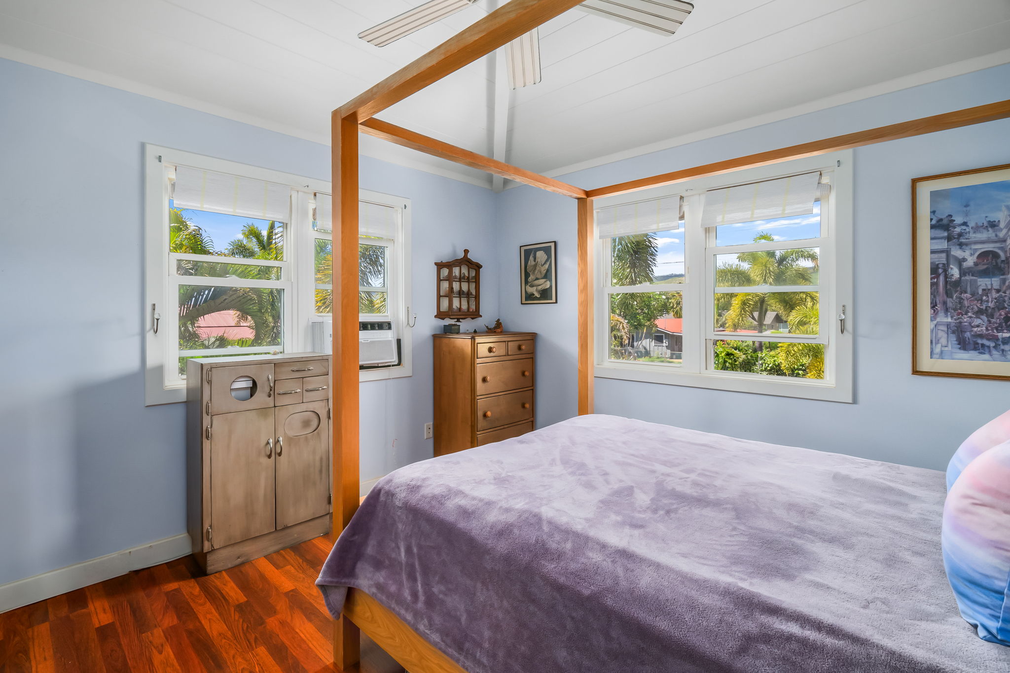 8244 A Elepaio Road Kekaha, HI 96752 - Photo 18 of 21 a bedroom with a bed and wooden floor