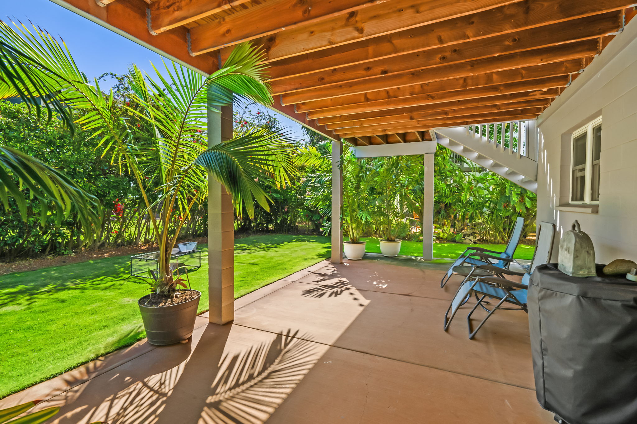 8244 A Elepaio Road Kekaha, HI 96752 - Photo 19 of 21 a patio with a yard table and chairs