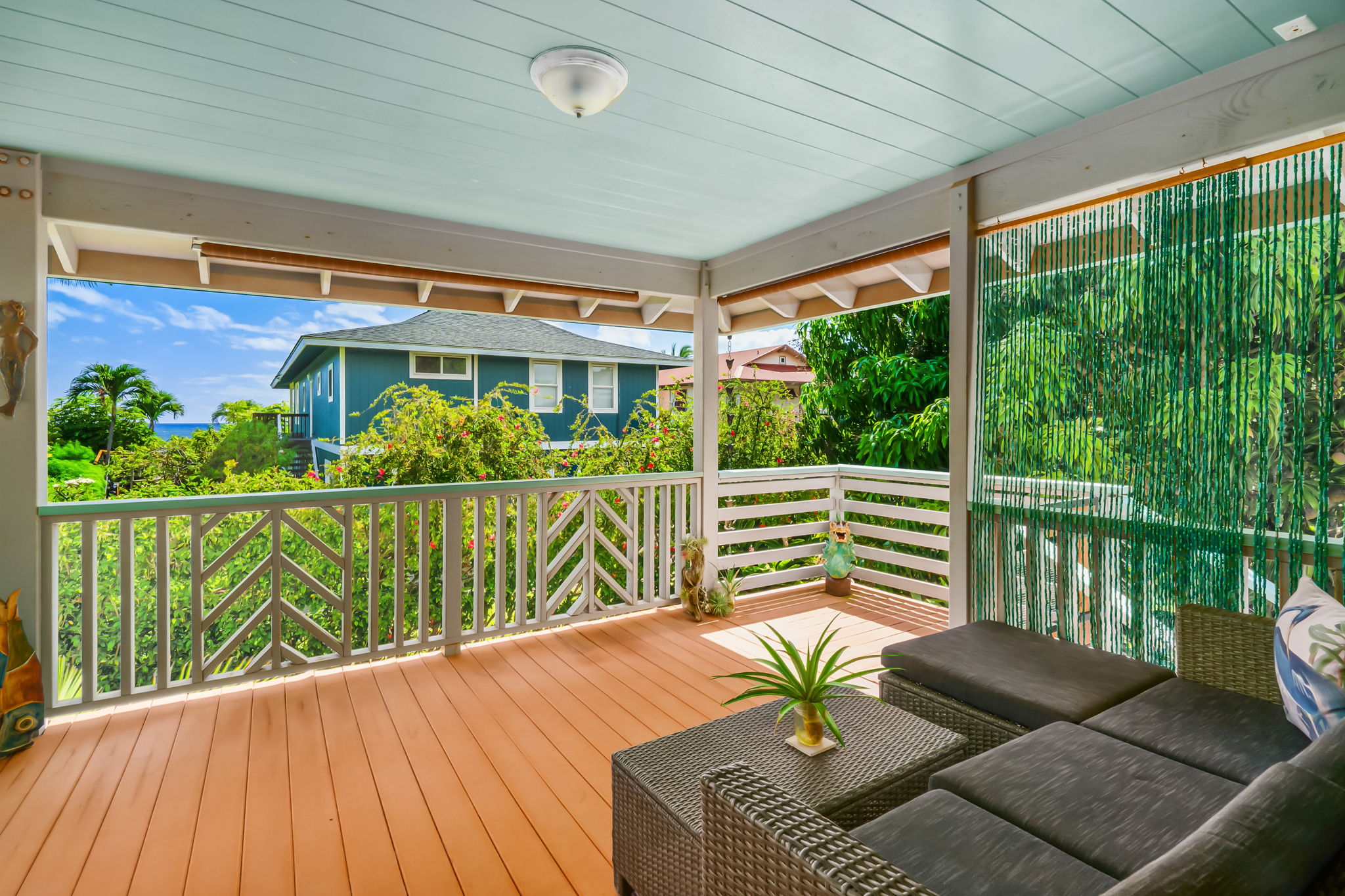 8244 A Elepaio Road Kekaha, HI 96752 - Photo 6 of 21 a balcony with wooden floor and outdoor seating
