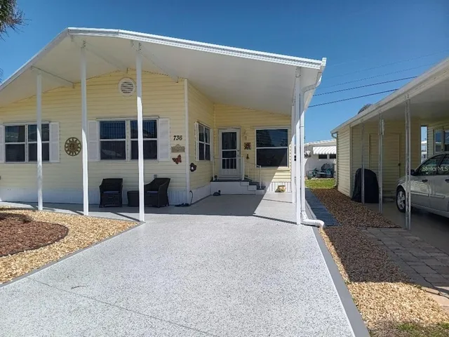 a view of a house with a couches and balcony view