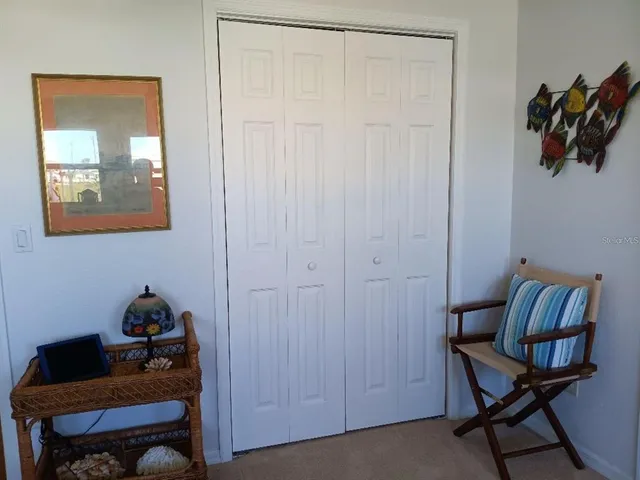 a room that has a dresser and a chair in it