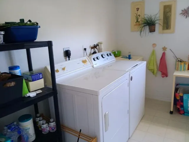 a utility room with dryer and washer