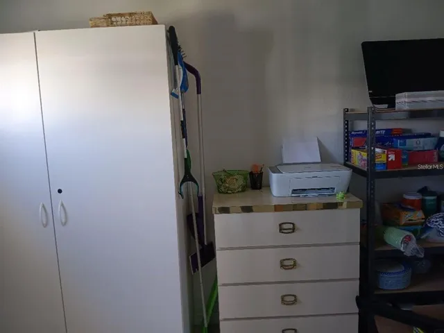 a view of storage and utility room with washer and dryer