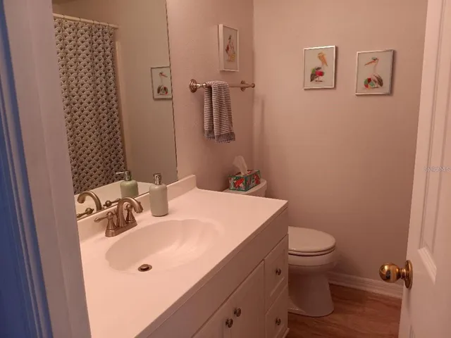 a bathroom with a sink and toilet