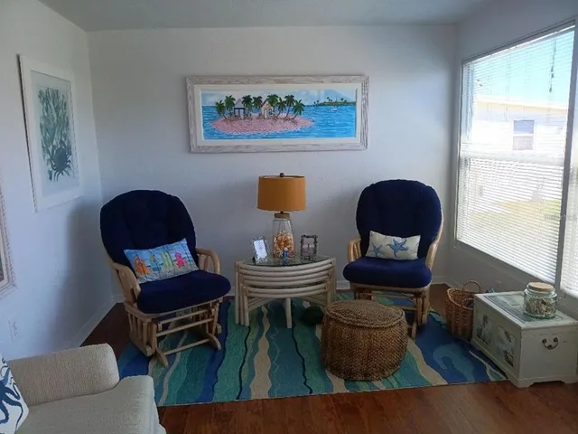a living room with furniture and a window