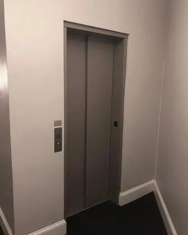 a view of hallway with closet