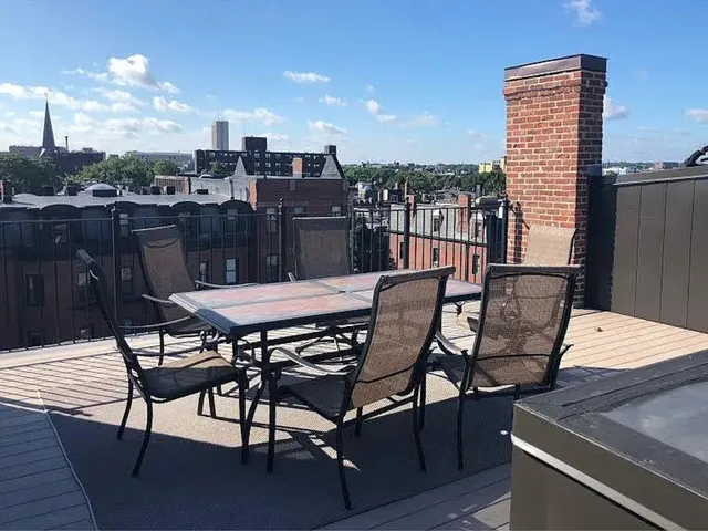 a view of a chairs and table in the terrace