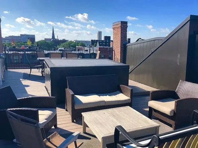 a view of a terrace with furniture and a potted plant