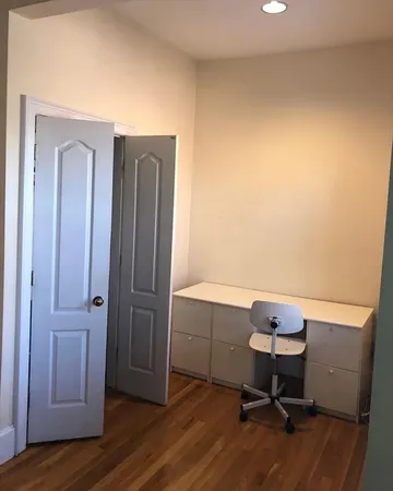a workspace with furniture and wooden floor