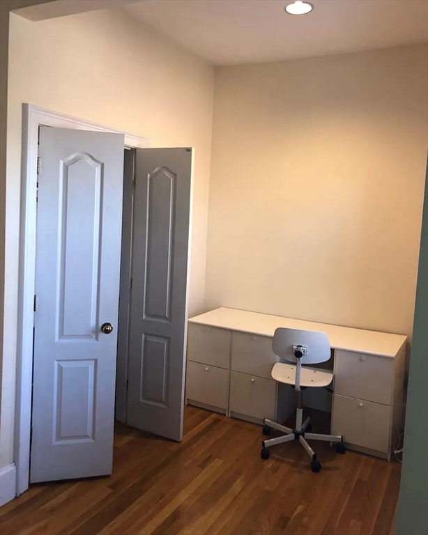 533 Columbus Avenue, Unit 8 Boston, MA 02118 - Photo 6 of 21 a workspace with furniture and wooden floor
