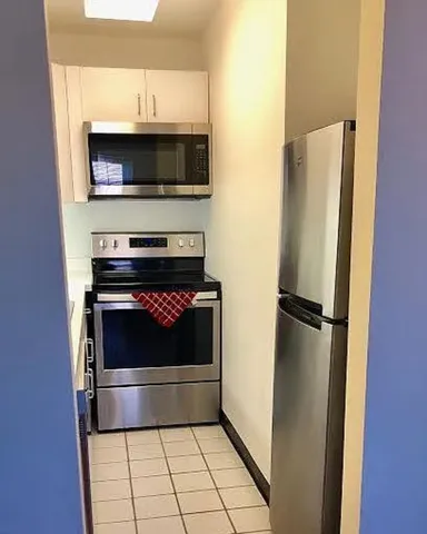 a kitchen with a stove and a microwave