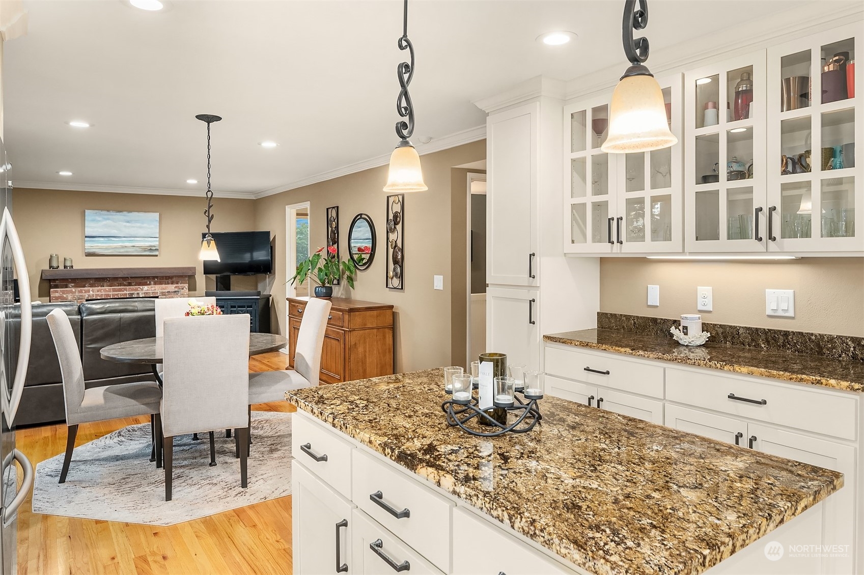 4927 Northeast 23rd Street Renton, WA 98059 - Photo 13 of 40 a kitchen with granite countertop a stove a sink and a refrigerator
